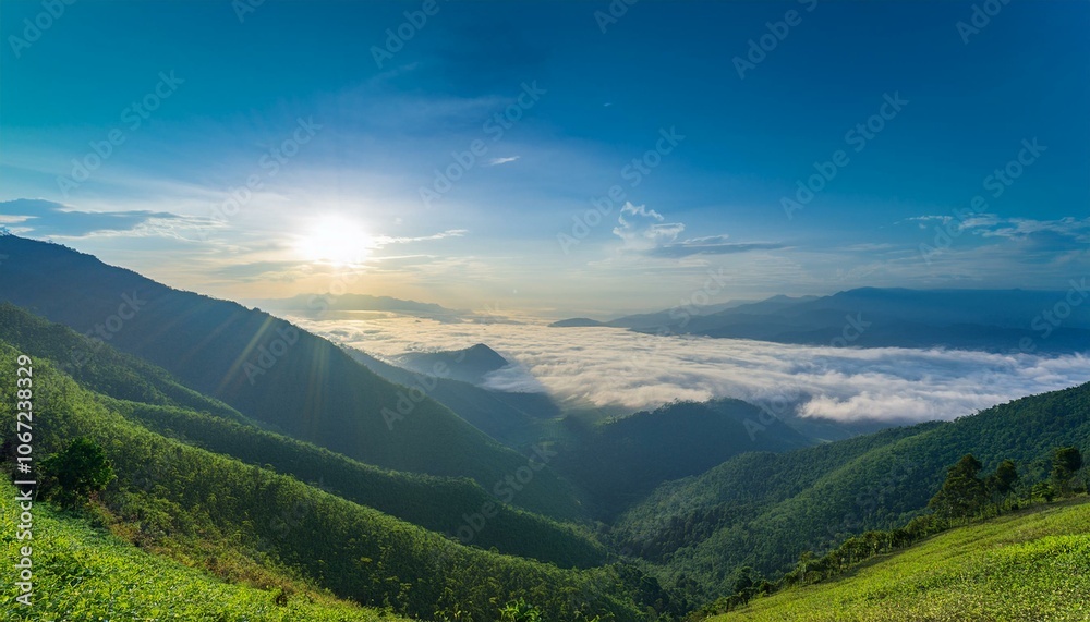 Fototapeta premium Waves of light in the mountain valley stretch into the sky