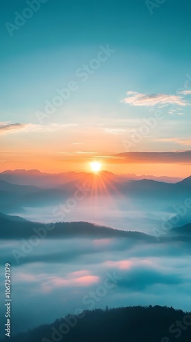 Sunrise over the mountains, a beautiful landscape with misty peaks and a blue sky