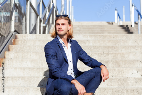 Handsome Young Man in Blue Suit Posing Outdoors