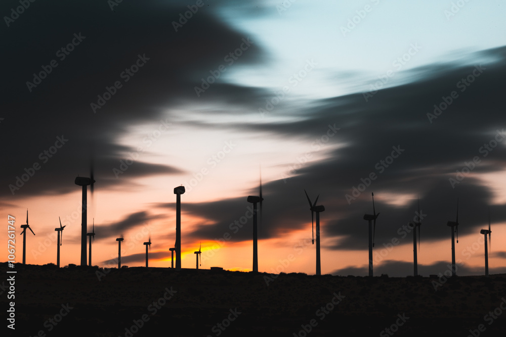 Fototapeta premium Long exposure of wind poles in Fuerteventura desert at blue hour