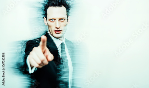 Businessman with pointing finger up, gesture of attention, background with morion effect and copy space photo