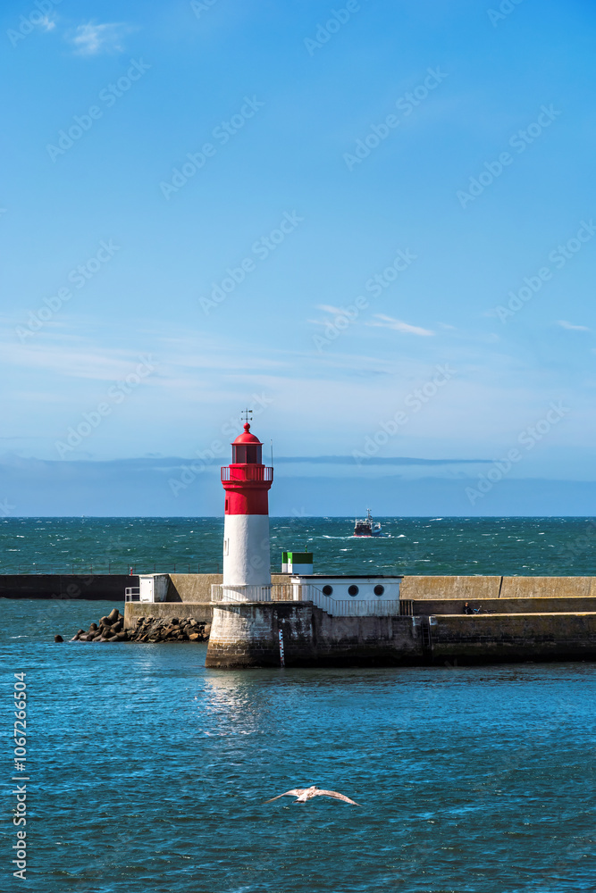 Lighthouse and harbor entrance of Le Guilvinec in Brittany in France Lighthouse and harbor entrance of Le Guilvinec in Brittany in France