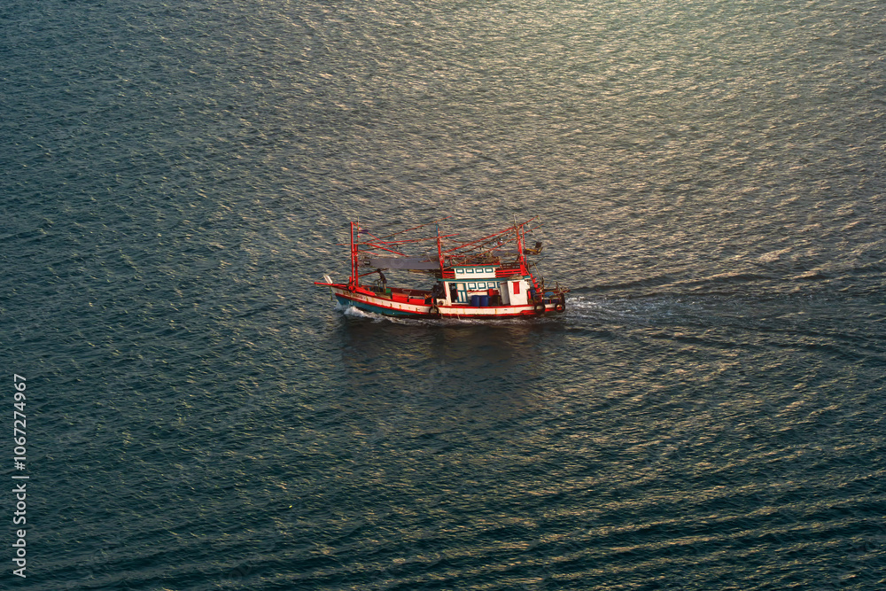 Large fishing boat in the sea. Aerial view of fishing boat. Large fishing boat sailing in the middle of the sea. Large fishing boats sail out to catch fish in the sea. Large fishing boat in the sea. Aerial view of fishing boat. Large fishing boat sailing in the middle of the sea. Large fishing boats sail out to catch fish in the sea.