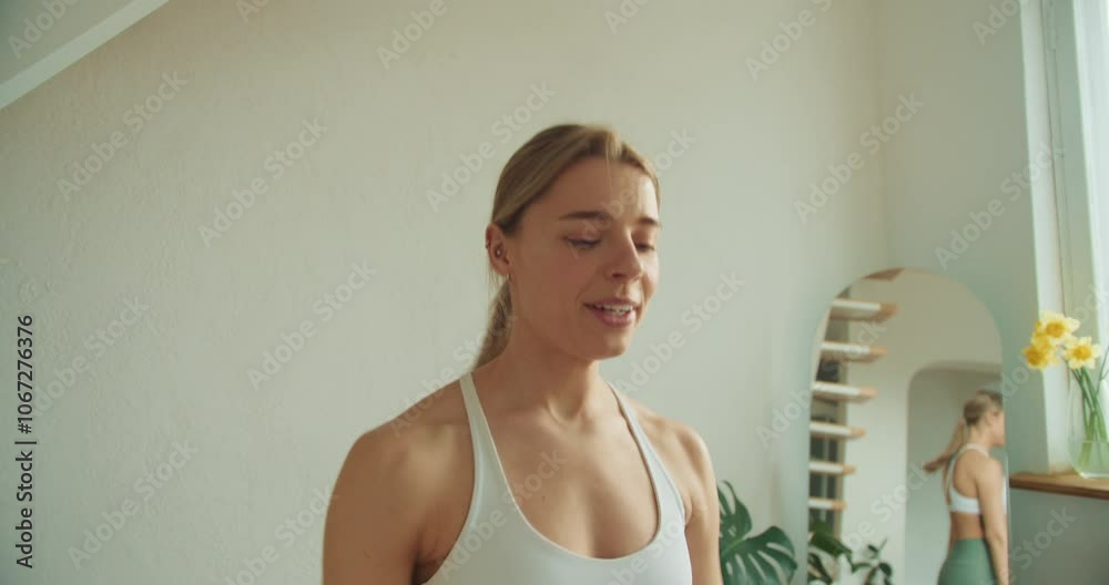 Happy Woman Raising Arms Post-Workout: Embracing Joy and Vitality in a Minimalist Fitness Space with Energized Expressions Happy Woman Raising Arms Post-Workout: Embracing Joy and Vitality in a Minimalist Fitness Space with Energized Expressions