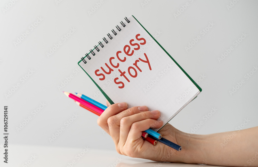 Success story text on blank business card in hand Success story text on blank business card in hand