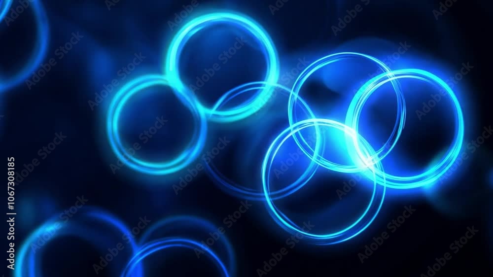 Swirling blue circles moving on a dark canvas, creating a captivating abstract display of color and motion Swirling blue circles moving on a dark canvas, creating a captivating abstract display of color and motion
