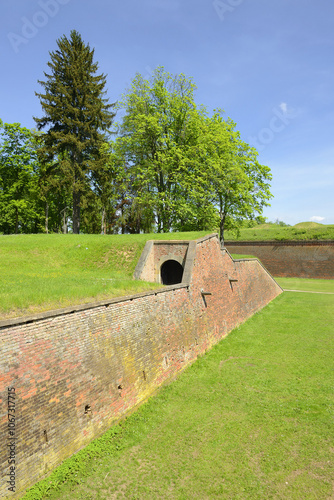 Obraz na płótnie Main defensive wall, fortress town Josefov near Jaromer. Circumference of fortress skired around a 30 metres wide ditch. It is a large historic defence complex of 18th-century military architecture w salonie