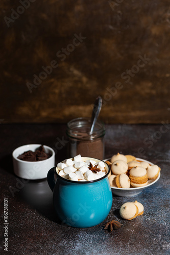 mug of spicy hot chocolate with marshmallows on dark background, vertical