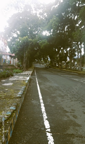 This is a morning street view in Curup, Bengkulu, Indonesia, taken from a vertical perspective. photo