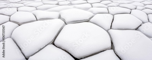 Frozen lake with cracks forming geometric patterns, capturing winters beauty and the art in natural formations photo