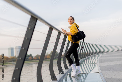 Cheerful woman in a yellow ...