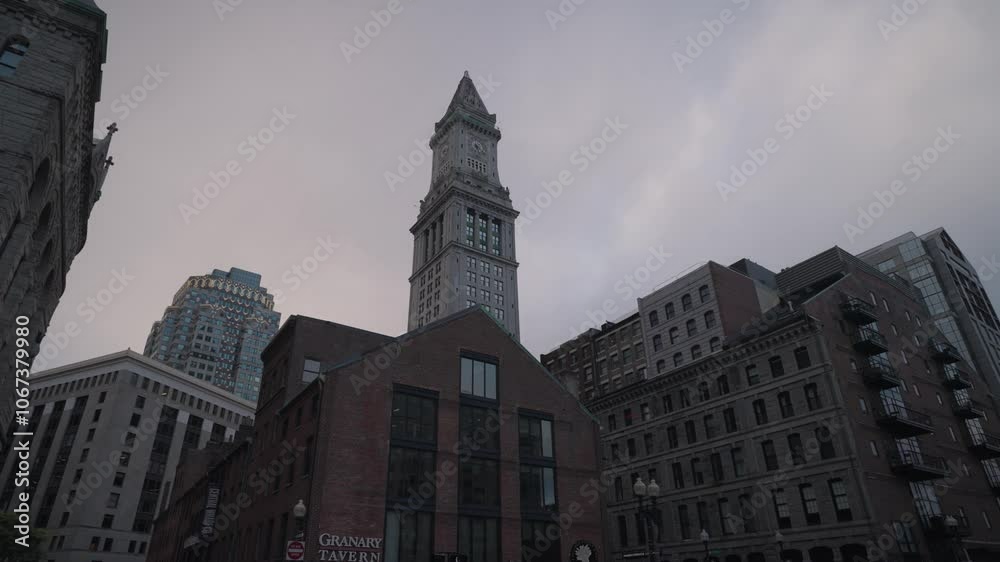 The buildings lined up along Purchase Street in Downtown Boston create a striking scene, set against the monumental backdrop of the Custom House Tower. The buildings lined up along Purchase Street in Downtown Boston create a striking scene, set against the monumental backdrop of the Custom House Tower.