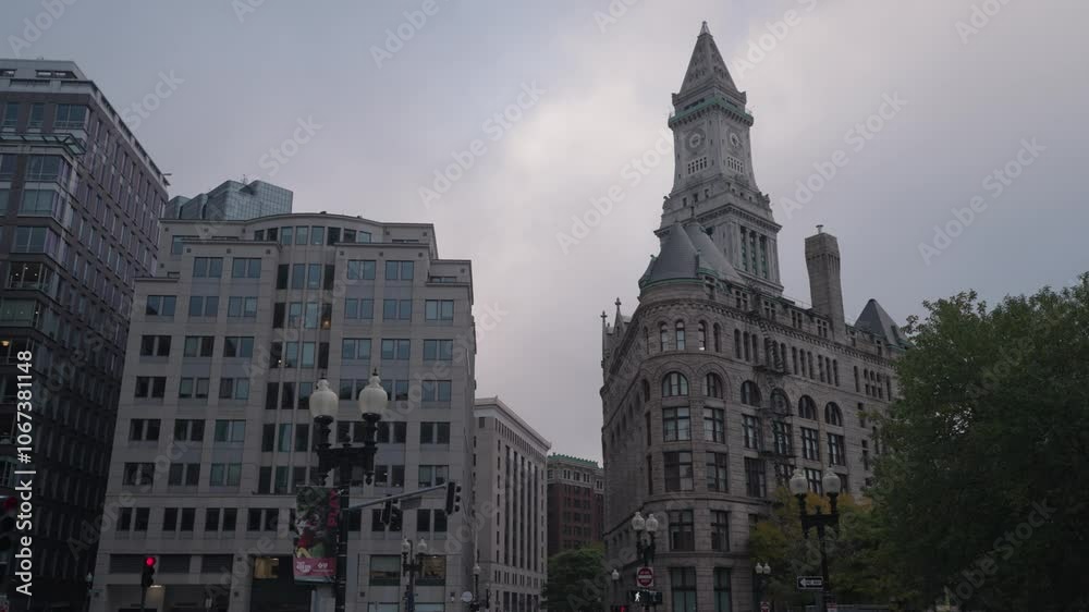 The buildings lined up along Purchase Street in Downtown Boston create a striking scene, set against the monumental backdrop of the Custom House Tower. The buildings lined up along Purchase Street in Downtown Boston create a striking scene, set against the monumental backdrop of the Custom House Tower.
