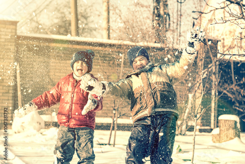 Two boys play with snow. Happy childhood. Brothers on a walk. two kids playing with snow. toned