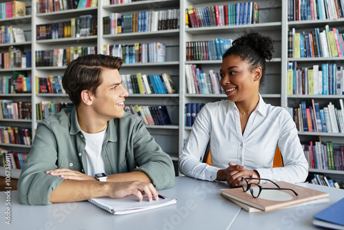 A dedicated teacher shares wisdom with her student, surrounded by colorful bookshelves.