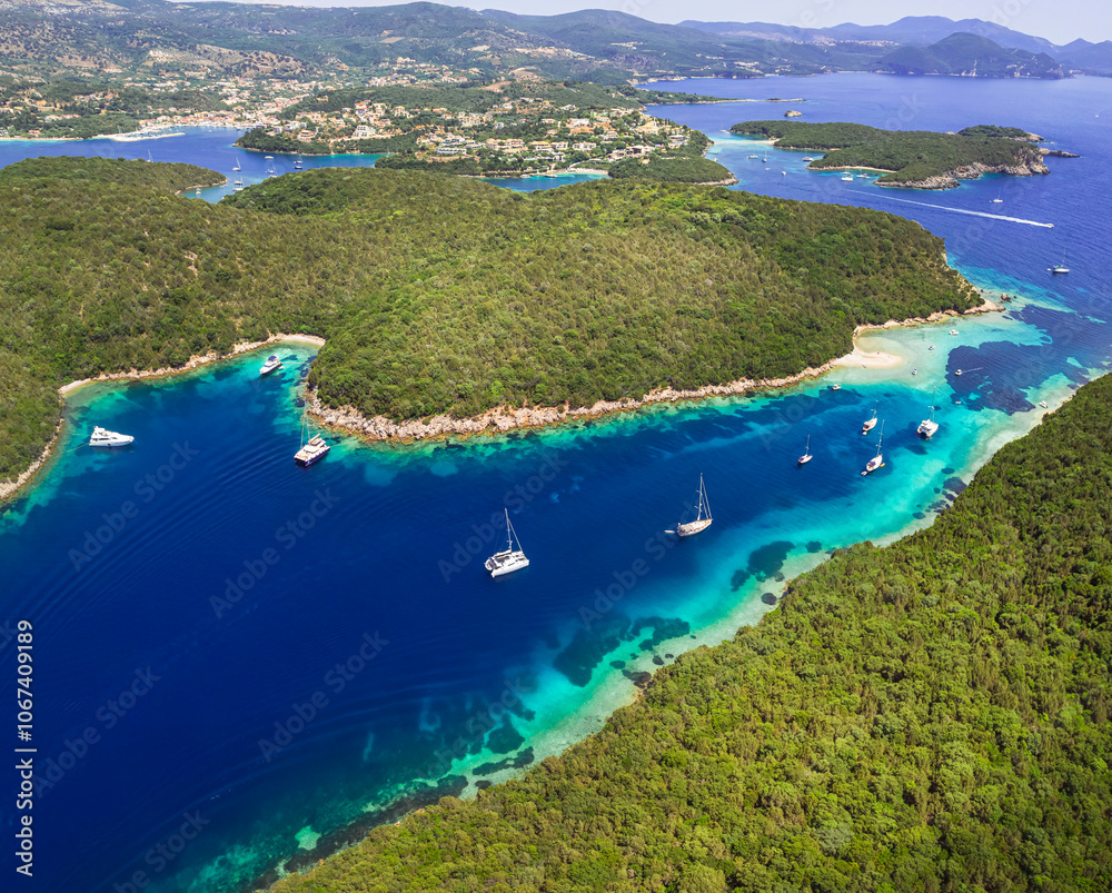 Obraz premium Epirus, Greece. Sivota - stunning aerial drone video of turquoise sea known as Blue Lagoon and unique beaches