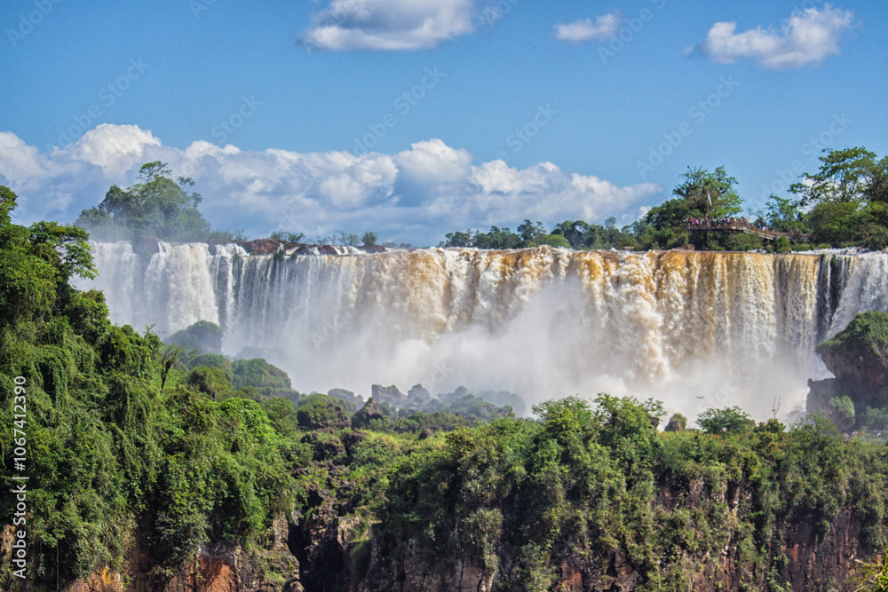 Fototapeta premium Panoramic view of Iguazu Falls on a sunny day, Misiones, Argentina