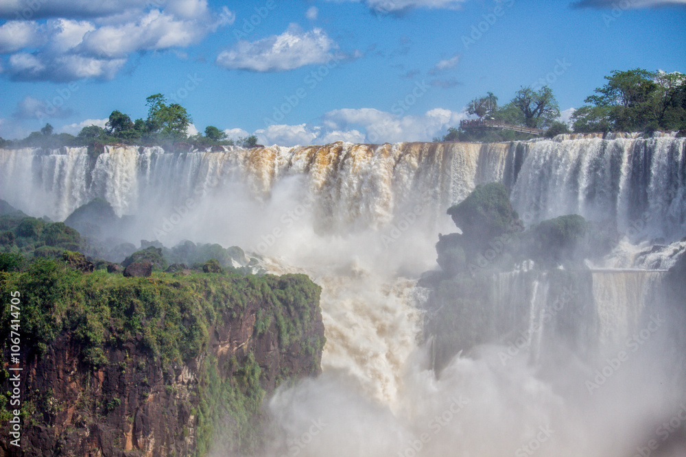 Panoramic view of Iguazu Falls on a sunny day, Misiones, Argentina Panoramic view of Iguazu Falls on a sunny day, Misiones, Argentina