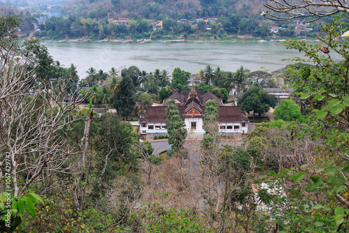 The landscape of the National Museum of Luang Prabang, Laos, which is the former Royal Palace. The background is the Mekong river. photo