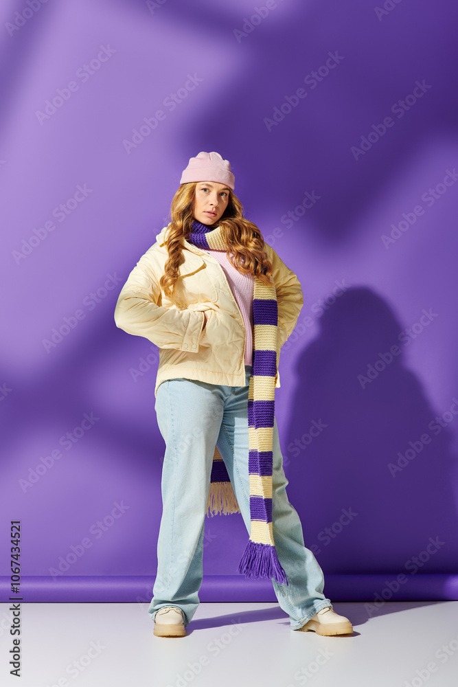 The young woman showcases her unique style with a cozy scarf and playful hat in a colorful setting. The young woman showcases her unique style with a cozy scarf and playful hat in a colorful setting.