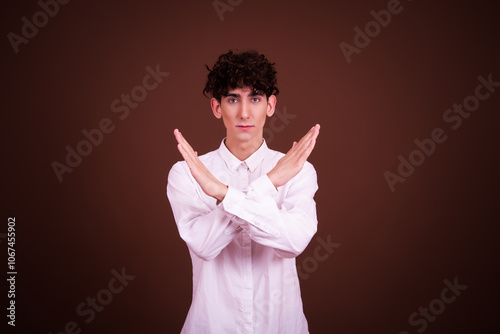Young attractive student posing in studio.