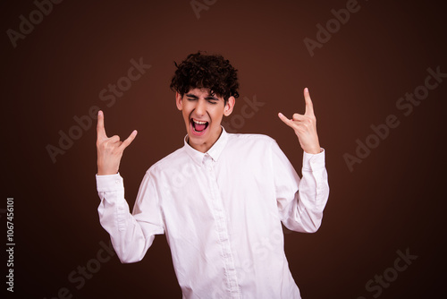 Young attractive student posing in studio.