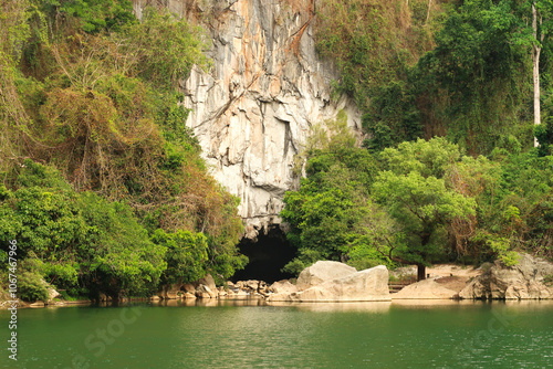 View onto the entrance of the Kong Lor Cave, a tourist attraction on the Thakhek Motorbike Loop, Laos photo