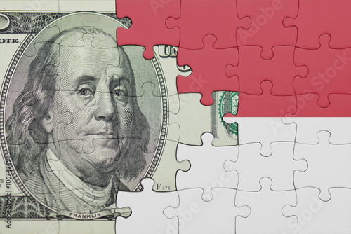 Wallpaper Mural puzzle with the national flag of indonesia and the usa dollar money .finance concept Torontodigital.ca