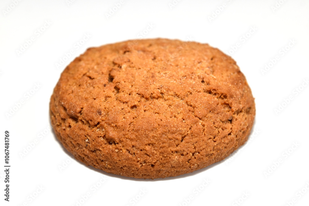 Round shaped oatmeal cookies lie on a white background. Round shaped oatmeal cookies lie on a white background.