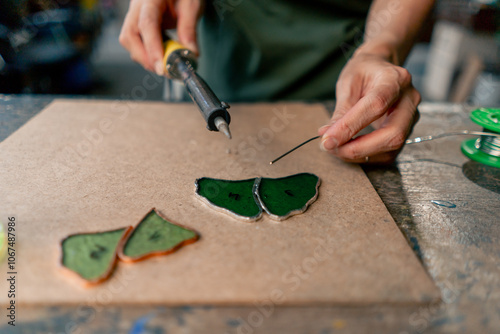 Canvas Print in a large green workshop on a woman with green hair creates decorative flowers