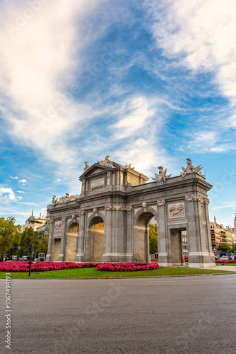 Alcala Gate with a sky full of clouds at dawn, photo with copyspace, Madrid, Spain. photo