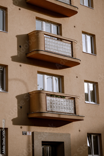 the exterior of a building with multiple balconies photo