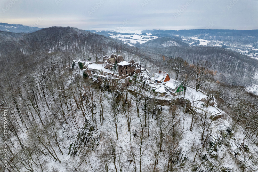Aerial view ruins of old castle. Winter. Ruin of Hohnstein Castle, Harz mountains, Germany.