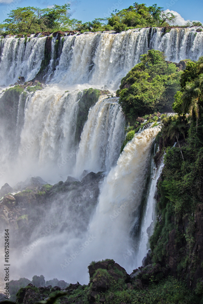 Waterfalls at Iguazu Falls on a sunny day, Misiones, Argentina Waterfalls at Iguazu Falls on a sunny day, Misiones, Argentina