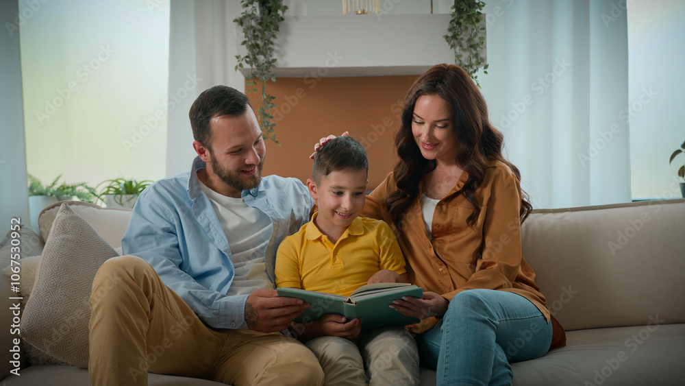 Loving caring mom dad reading fairy tale story to cute son parents kid boy child relaxing together read book at home on sofa responsible parenthood happy Caucasian family development teaching support Loving caring mom dad reading fairy tale story to cute son parents kid boy child relaxing together read book at home on sofa responsible parenthood happy Caucasian family development teaching support