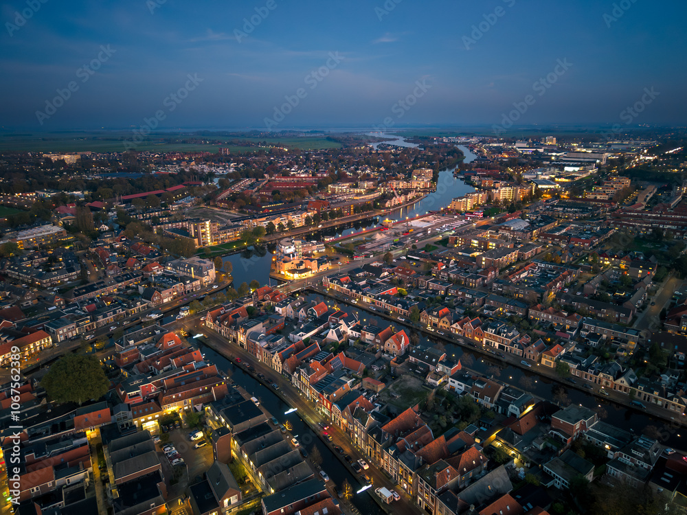 Fototapeta premium Aerial drone image of historic Frisian city of Sneek at night