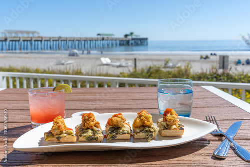 Fried oysters on the shells at the beach  photo