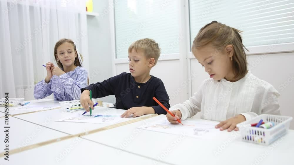 children with a teacher at a kindergarten class children with a teacher at a kindergarten class