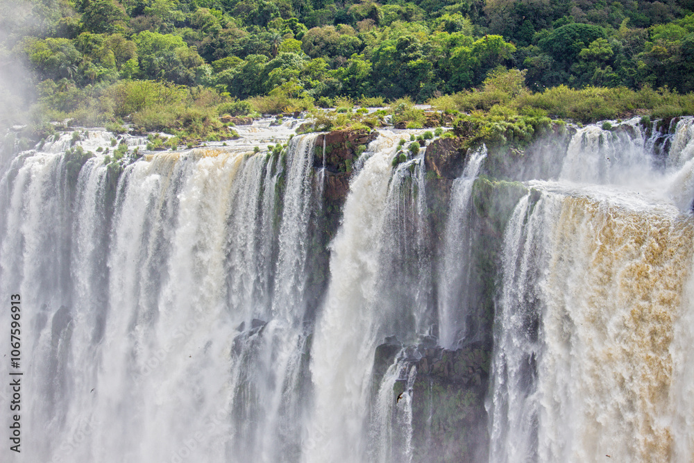edge of a waterfall at Iguazu Falls, Misiones, Argentina edge of a waterfall at Iguazu Falls, Misiones, Argentina