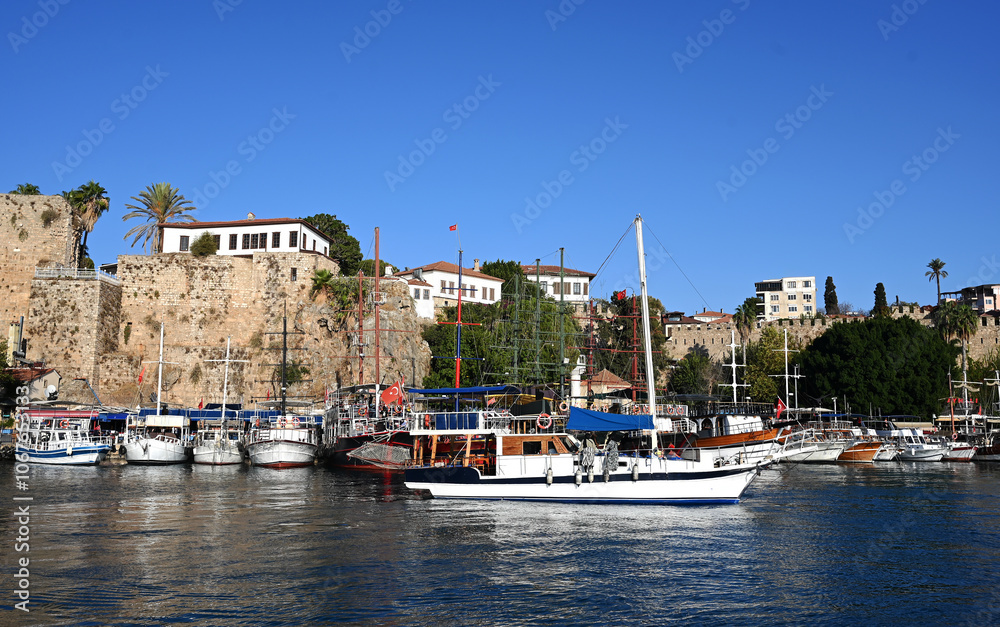 Fototapeta premium Antalya Kaleici Marina, sunset in the Mediterranean, view of the Taurus Mountains, boats