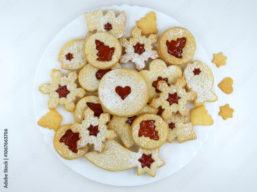 Linzer cookies on a white plate and white background Linzer cookies on a white plate and white background