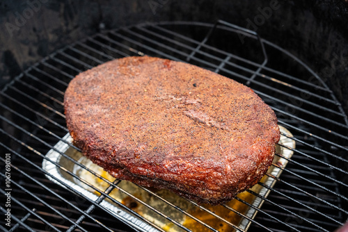 Smoked brisket cooked on a grill  photo