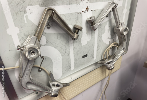 Close-up of metal surgical tools on a sterile surface in a hospital operating room. Instruments like scalpels, clamps, and forceps symbolize precision, care, and the life-saving role of surgery photo