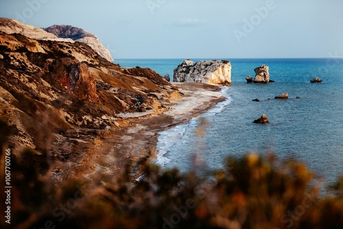 Scenic view of Petra tou Romiou, Cyprus, with rugged coastline and turquoise sea under a clear sky photo