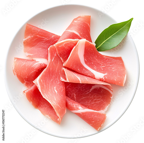Close-up of thinly sliced prosciutto on a white plate with a bay leaf.