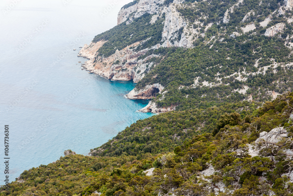 Obraz premium Beautiful view at Sardinian coast in Gulf of Orosei region, Italy. Blue Mediterranean sea view near Cala Sisine beach. Beautiful Sardinian landscape.
