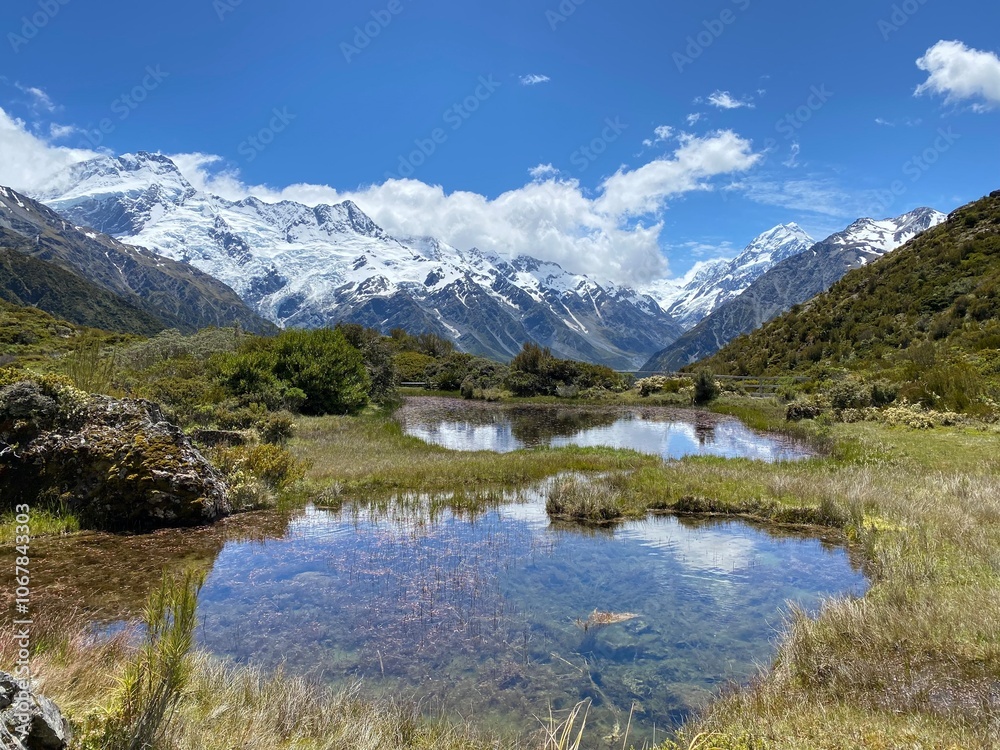 Hill top views of Aoraki Mount Cook reflecting in water at Red Tarns, Mount Cook National Park, New Zealand. Landscape with lake and mountains Hill top views of Aoraki Mount Cook reflecting in water at Red Tarns, Mount Cook National Park, New Zealand. Landscape with lake and mountains