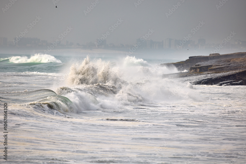 Obraz premium The power of water in motion. Nature’s relentless sculptor, carving cliffs and reshaping shores. A reminder that even the strongest foundations are no match for time and tide. Caplina Chorrillos Peru