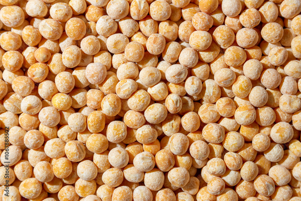 Uncooked Yellow Polished Peas Background. A Culinary Canvas of Dry Yellow Peas, Creating a Lively and Textured Background for Gourmet Cooking. Scattered Raw Polished Peas. Healthy Eating Ingredients Uncooked Yellow Polished Peas Background. A Culinary Canvas of Dry Yellow Peas, Creating a Lively and Textured Background for Gourmet Cooking. Scattered Raw Polished Peas. Healthy Eating Ingredients