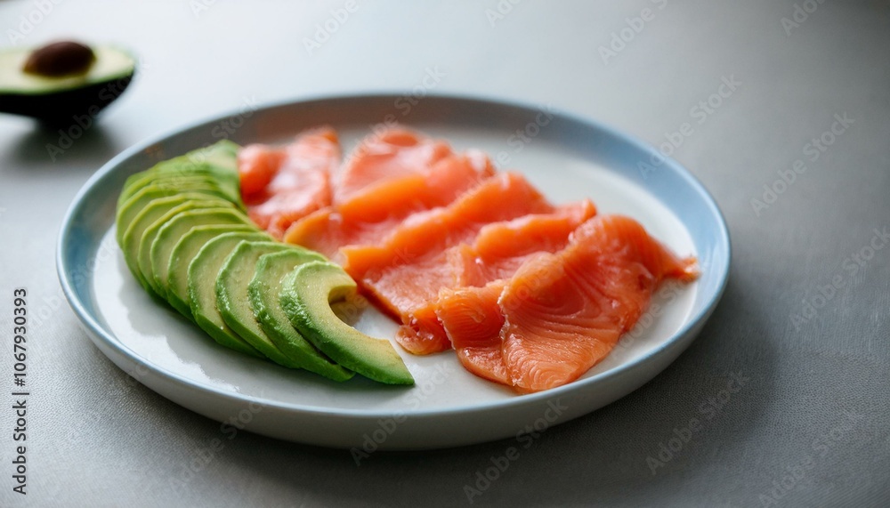 A plate of avocado and salmon slices A plate of avocado and salmon slices